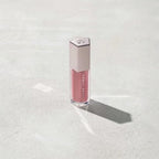 Marom Fenty Beauty Gloss Bomb Universal Lip Luminizer in a rose-tinted shade with a metallic hexagonal cap
