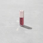 Marom Fenty Beauty Gloss Bomb Universal Lip Luminizer in a berry shade with a metallic hexagonal cap