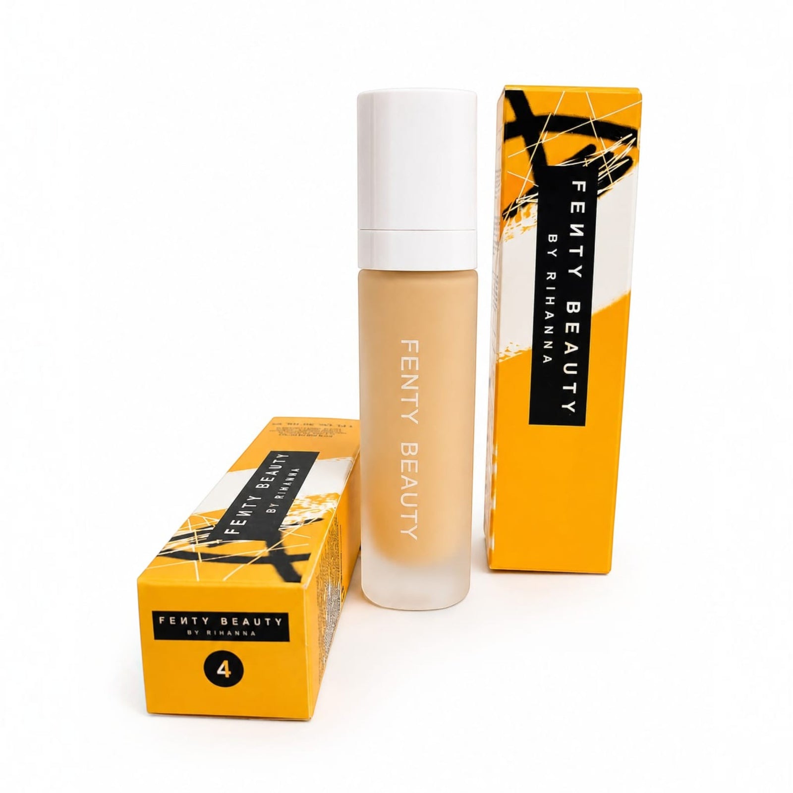 Marom FENTY BEAUTY by RIHANNA liquid foundation bottle with matching yellow and black packaging boxes