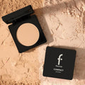 Marom Flormar Baked Powder in a black compact case with a smooth, luminous finish on a textured powder background.