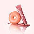 Marom LANEIGE Glaze Craze Tinted Lip Serum in Peach Glaze next to a glazed peach donut on a soft pink background.