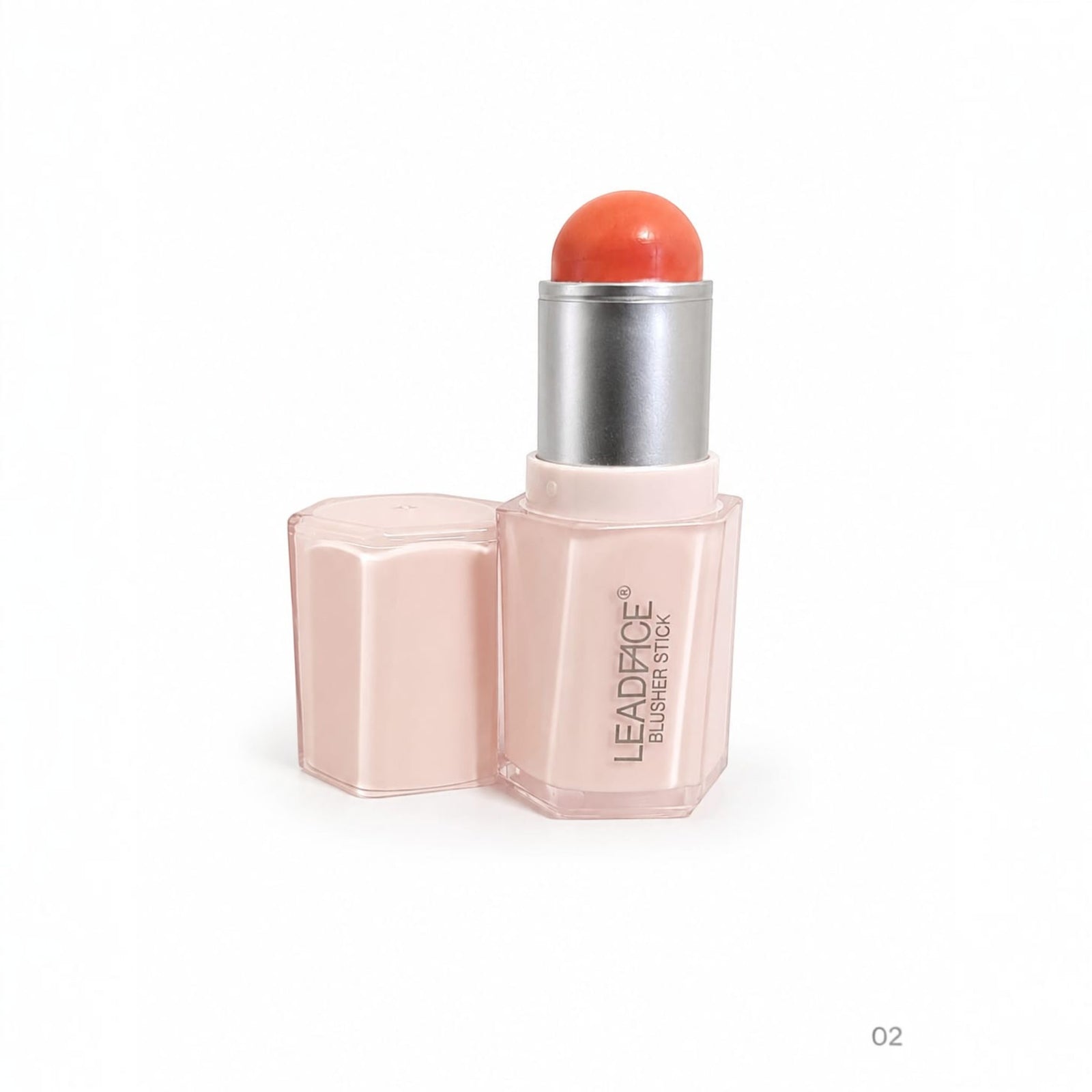 Marom Leadface blusher stick in a coral shade with a pale pink hexagonal case and silver applicator base