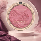 Marom MSYAHO baked powder makeup palette in a shimmering pink shade with embossed floral design on a pedestal