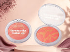 Marom MSYAHO terracotta makeup powder compacts with a marbled peach and gold finish for a warm, glowing complexion.