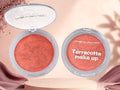 Marom MSYAHO terracotta makeup powder in a round compact with a marbled orange and bronze finish for a warm glow.