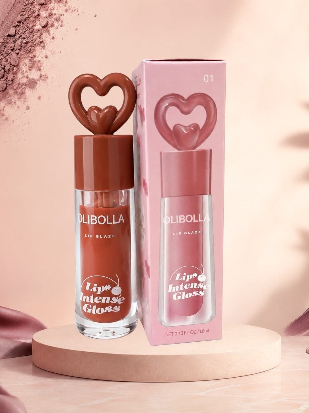 Marom Olibolla Lip Glaze Jelly Crystal in a brown shade with a heart-shaped cap, displayed next to its pink packaging.