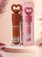 Marom Olibolla Lip Glaze Jelly Crystal in a brown shade with a heart-shaped cap and matching decorative box.
