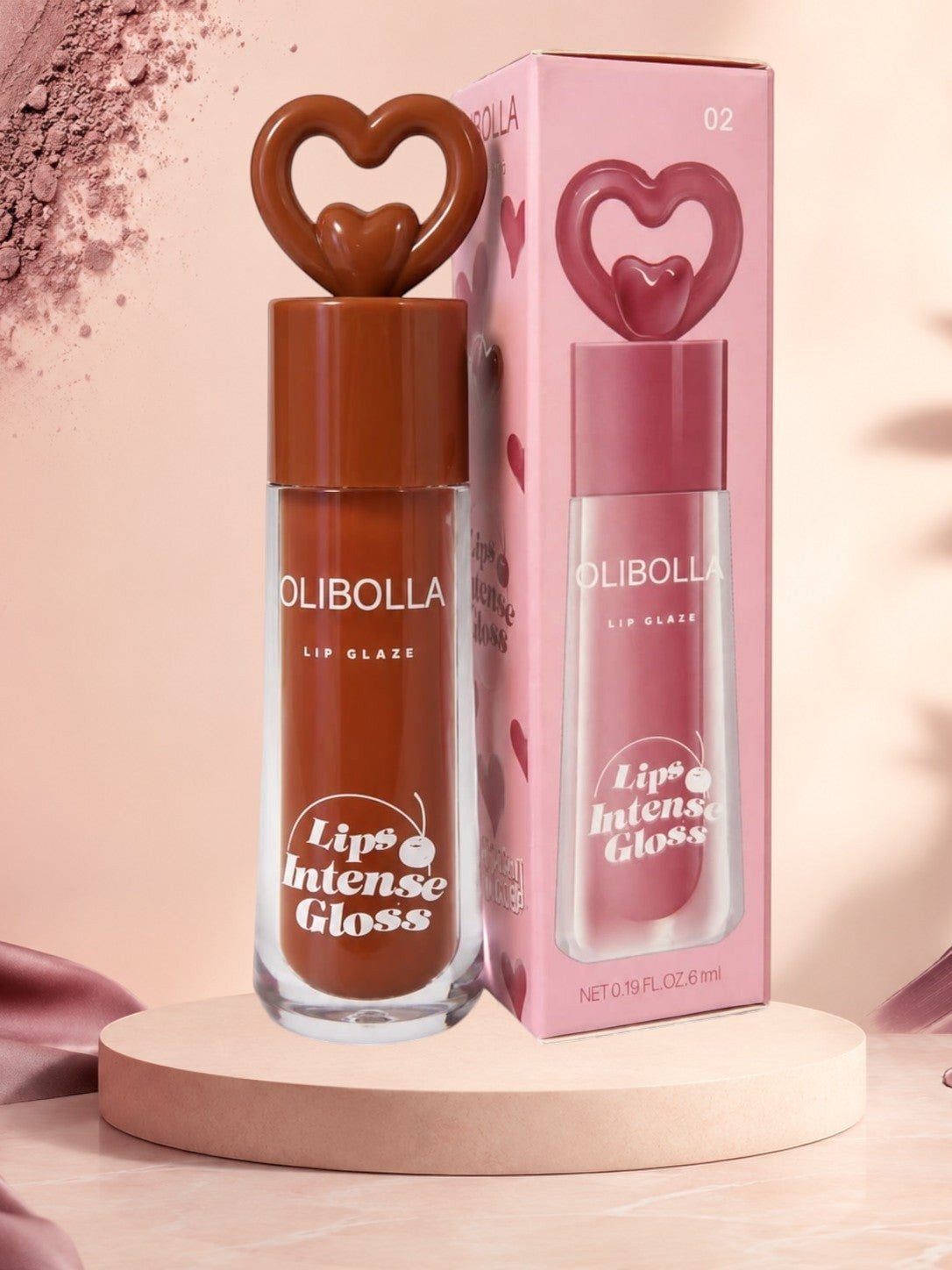 Marom Olibolla Lip Glaze Jelly Crystal in a brown shade with a heart-shaped cap and matching decorative box.