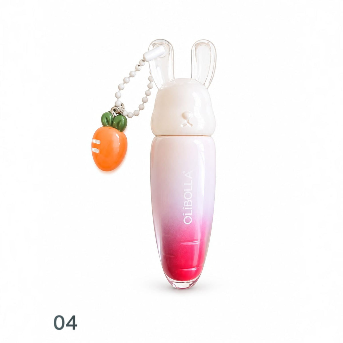 Marom Olibolla glossy lip tint in a carrot-shaped tube with a white bunny cap and a small carrot charm