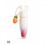 Marom Olibolla glossy lip tint in a white and pink gradient tube with a cute bunny cap and carrot charm