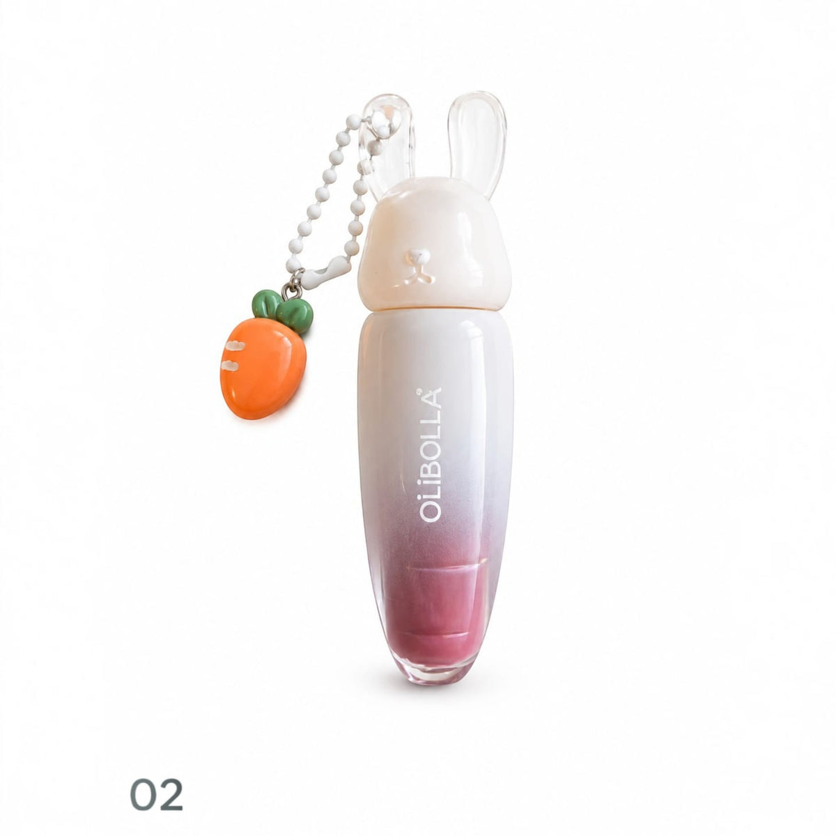Marom Olibolla glossy lip tint in a white and pink gradient tube with a cute rabbit cap and carrot charm