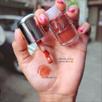 Marom Olibolla Glossy Lip Tint in shade 04, a shimmering coral-toned liquid lip product with a glossy finish.