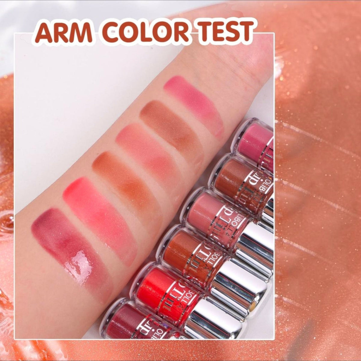 Marom Olibolla Glossy Lip Tint swatches on arm showing six vibrant shades with a high-shine, buildable finish.