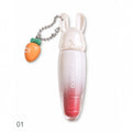 Marom Olibolla glossy lip tint in a white rabbit-shaped container with a cute carrot charm on a silver chain