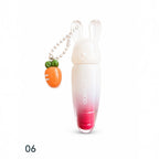 Marom Olibolla glossy lip tint in a white and pink gradient tube with a cute rabbit cap and carrot charm