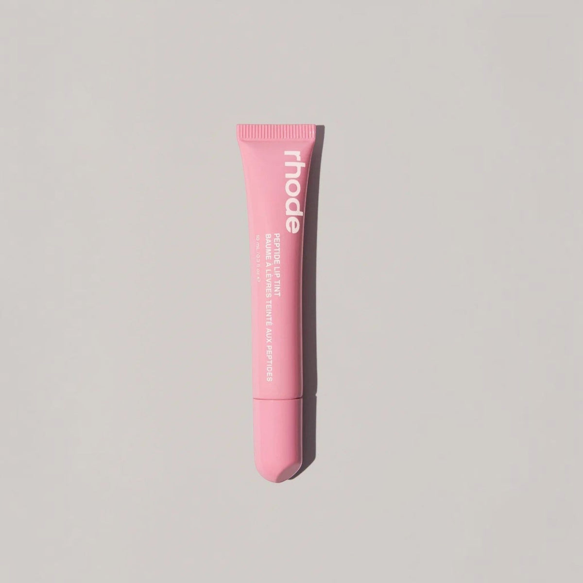 Marom rhode Peptide Lip Tint in a soft pink squeeze tube for hydrated and glossy lips