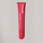 Marom rhode Peptide Lip Tint in a vibrant pink squeeze tube for hydrating and nourishing lip care.