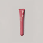 Marom rhode Peptide Lip Tint in a pink squeeze tube for hydrating and nourishing lips with a sheer glossy finish.