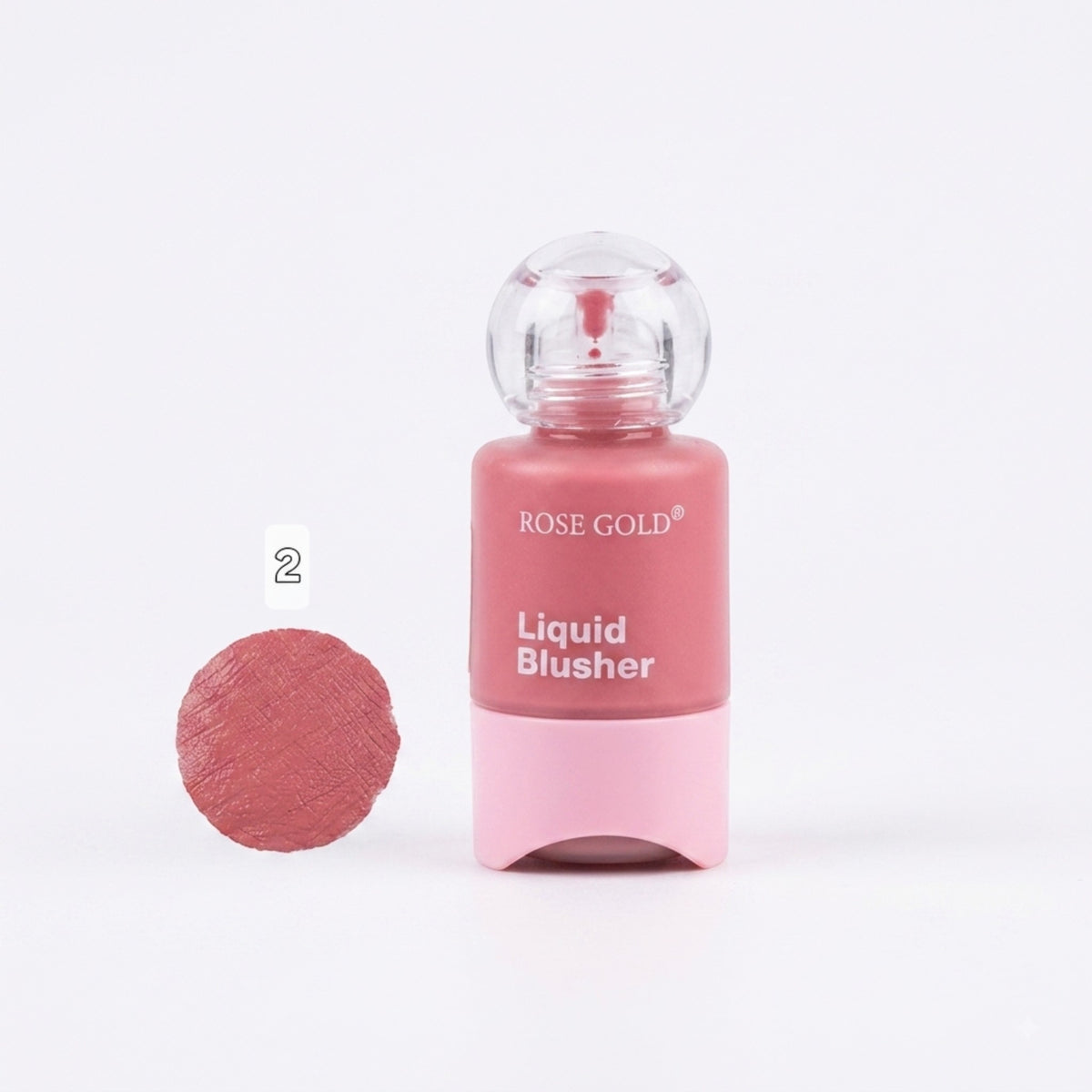 Marom Rose Gold liquid blusher in a soft pink shade with a clear cap and a swatch sample on a white background