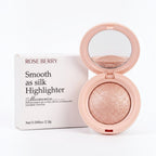 Marom ROSEBERRY Smooth as Silk golden highlighter powder in a round compact with a mirror and its white box.