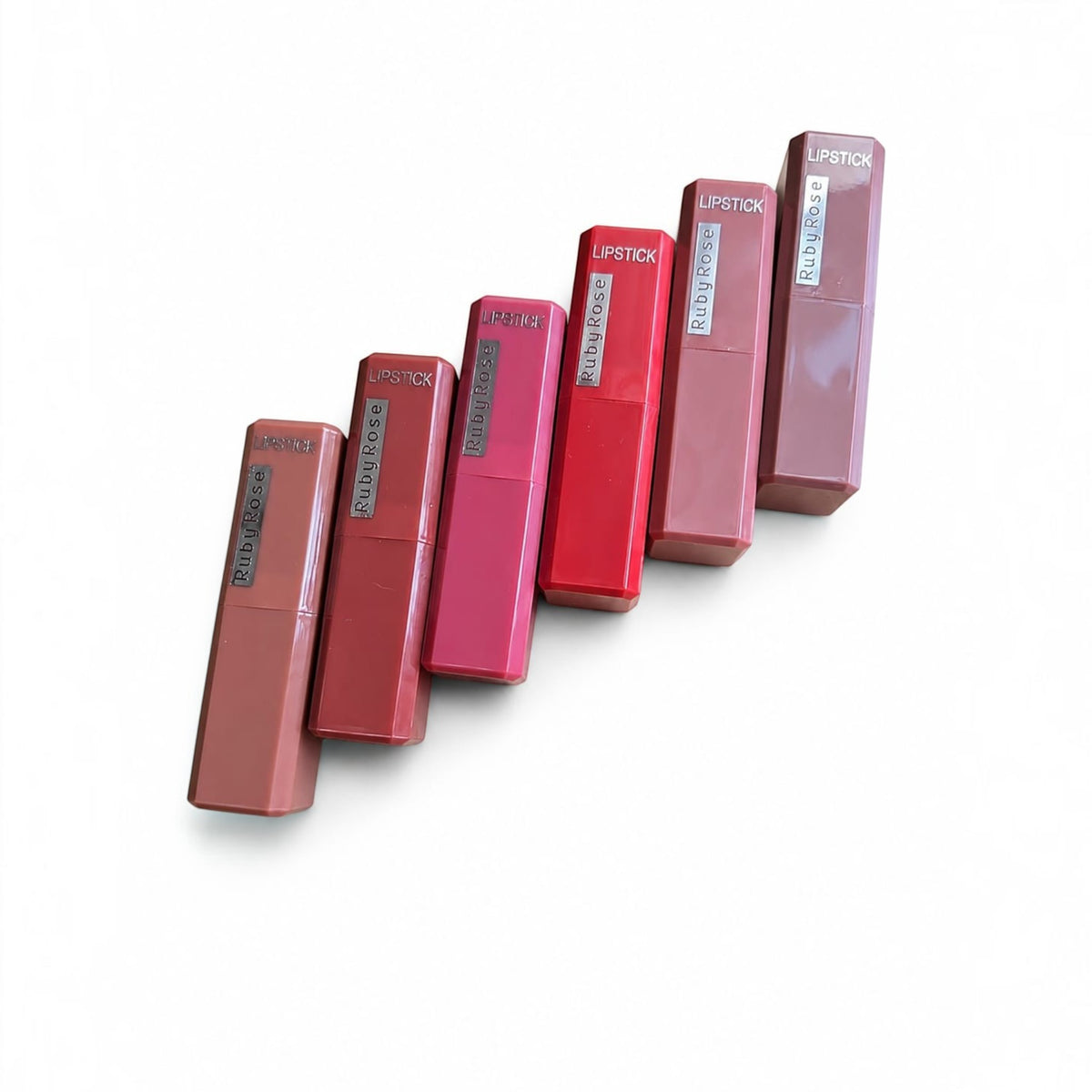 Marom Ruby Rose matte finish lipsticks in a range of pink and red shades arranged in a diagonal line