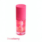 Marom Ruby Rose strawberry lip oil in a clear bottle with a pink cap, featuring nourishing jojoba and avocado oils.