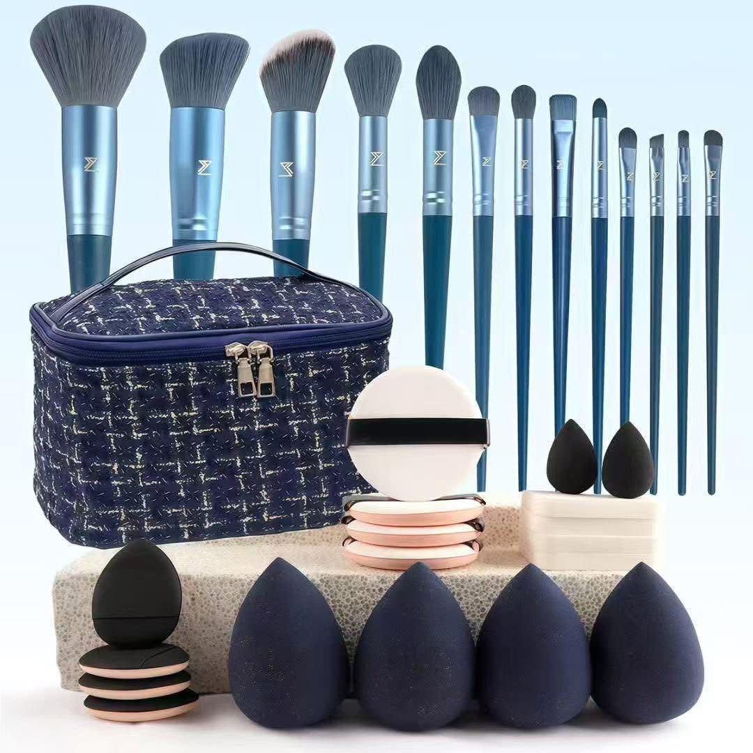 Navy blue makeup brush and sponge set with storage bag and puffs